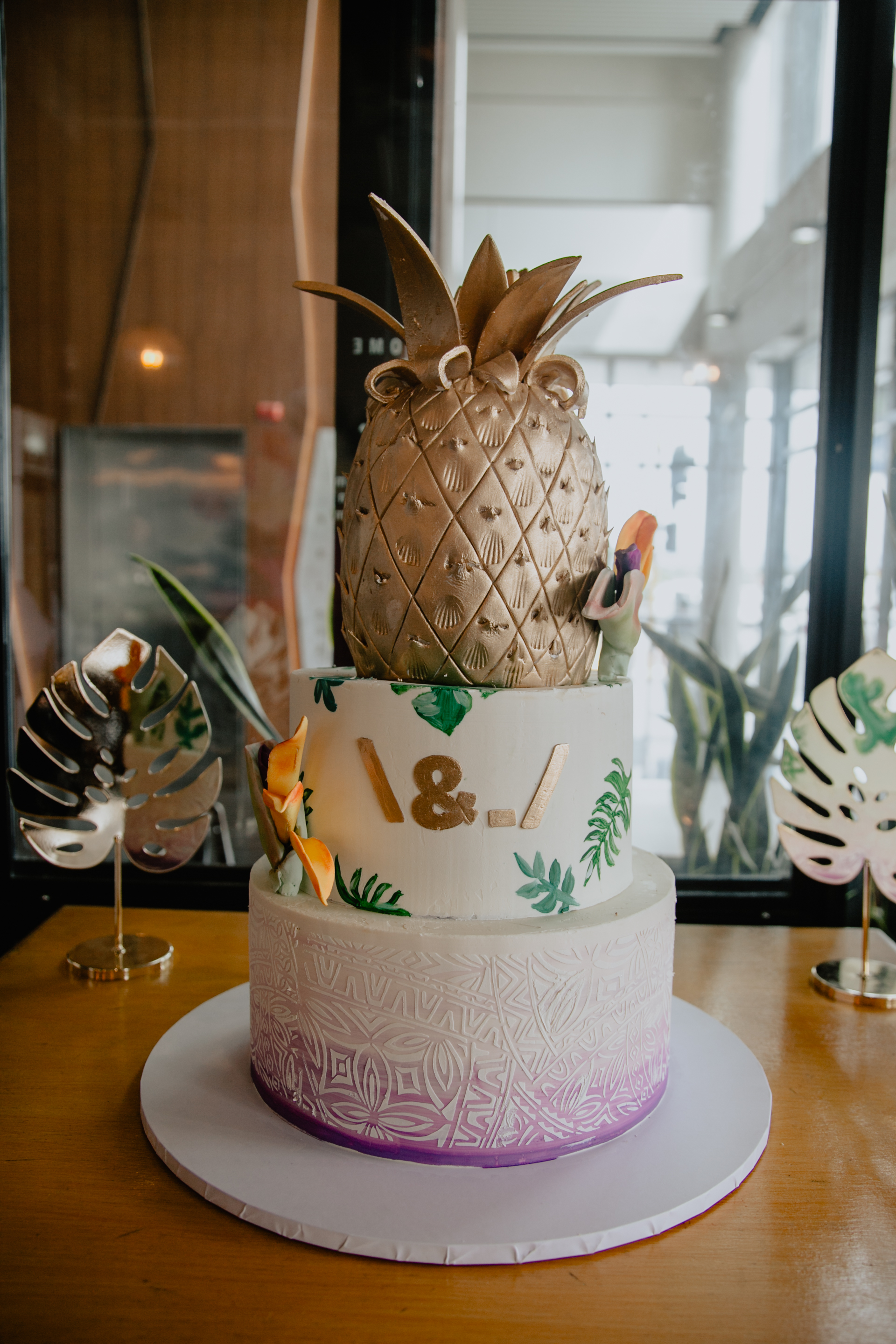 Unique cake with pineapple top tier