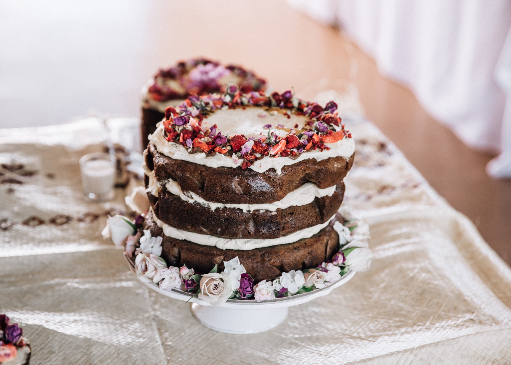 Three tiered cake with dried fruit atop