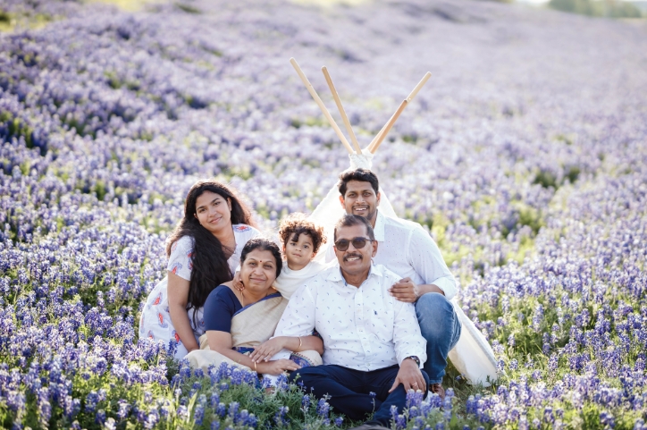 Family of five sitting in lavender field for family photo