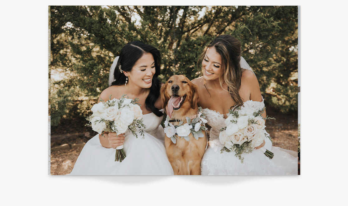 Magazine with newlywed brides in wedding dresses with dog between them