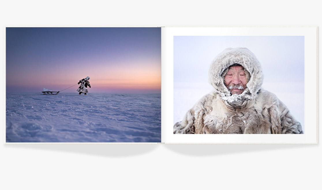 Landscape Photo Album with photo of eskimo pulling sled on icy snow floor