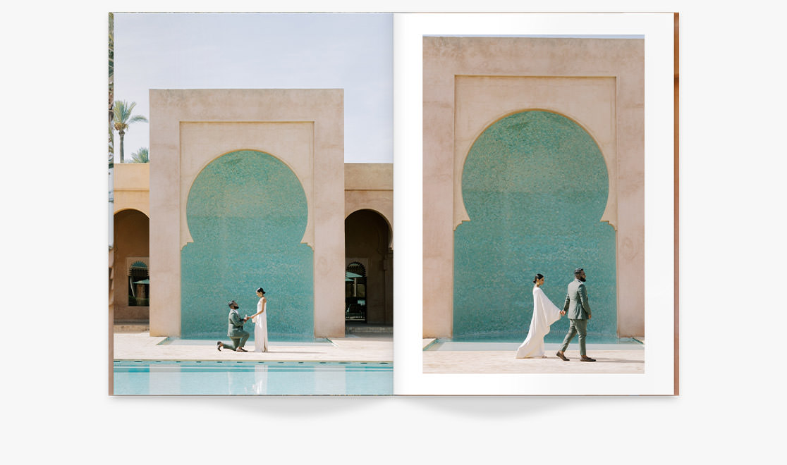 Man in suit proposes to woman in saree dress in front of pool on sunny day