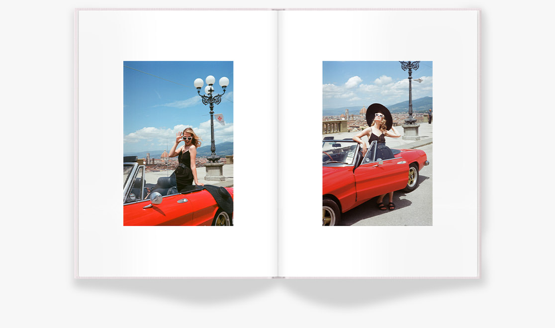 Pink Portrait Premium Photo Book of a woman on a red car wearing black retro attire under bright sunlight in Verona, Italy
