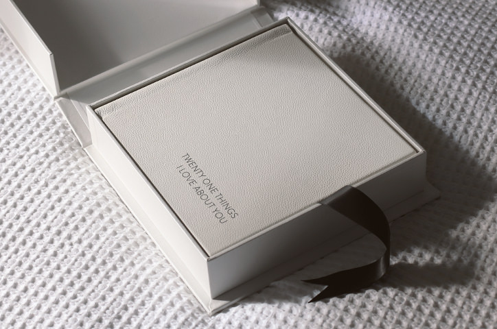 White Leather Photo Album inside Presentation Box with black ribbon