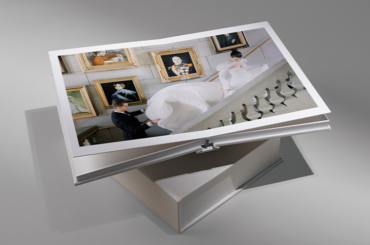 Open spread Premium Photo Album with bride and groom walking upstairs