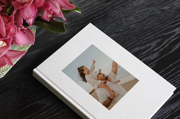 photo book on table with family photo on cover.