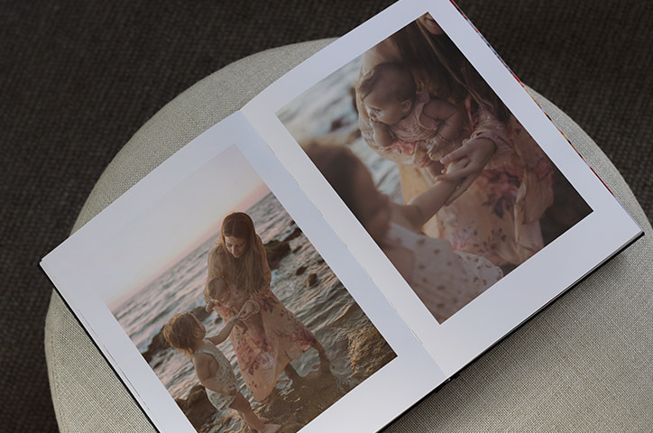 Open photo book with family portraits