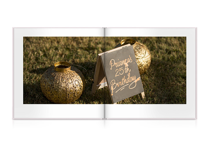 Fotolivro de fotos aberto com foto da decoração do aniversário.