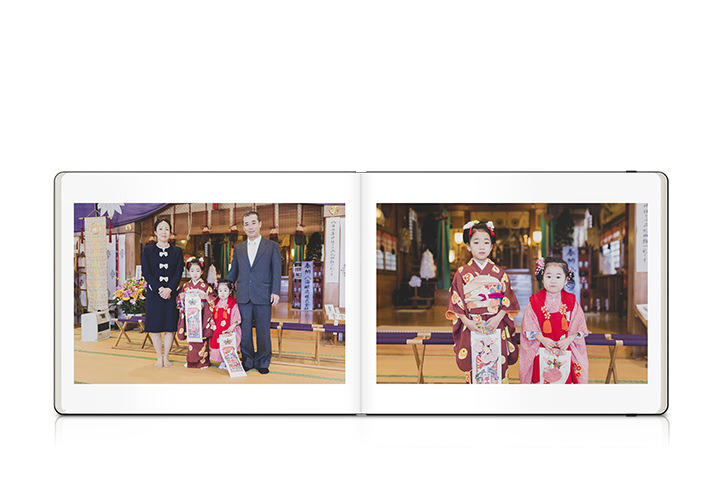 Open Moleskine Photo Book with spread of family imagery