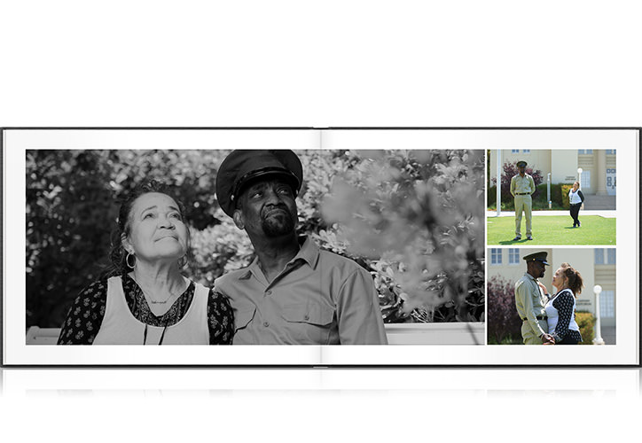 Open photo book showing spread of couple photos