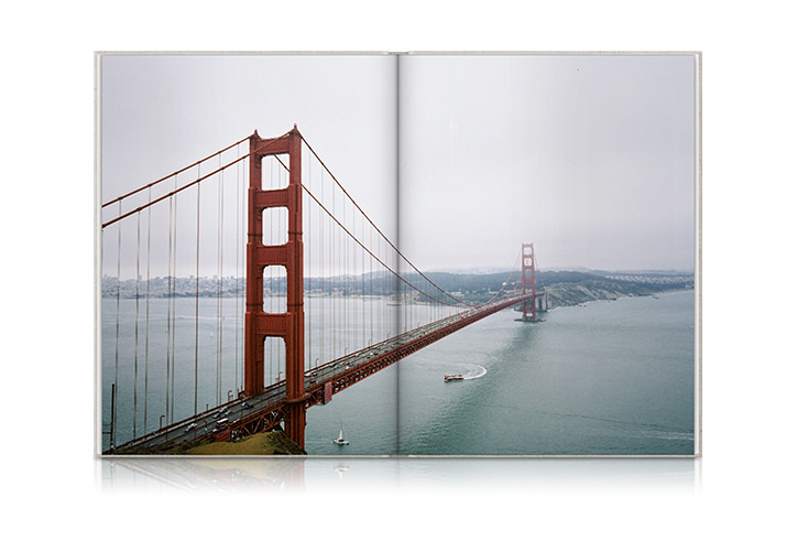 Portrait Travel Photo Book with view of the Golden Gate Bridge during cloudy weather