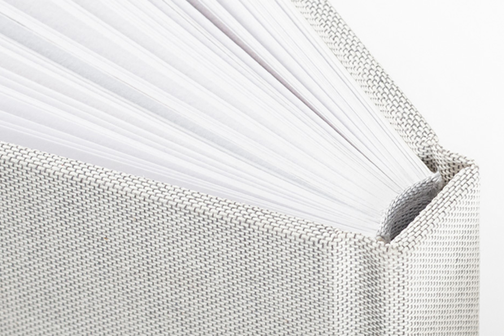 Close up on natural linen premium photo book cover, pages and binding