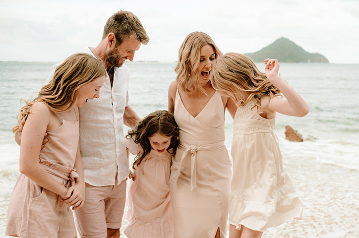 Pregnant couple walking down street