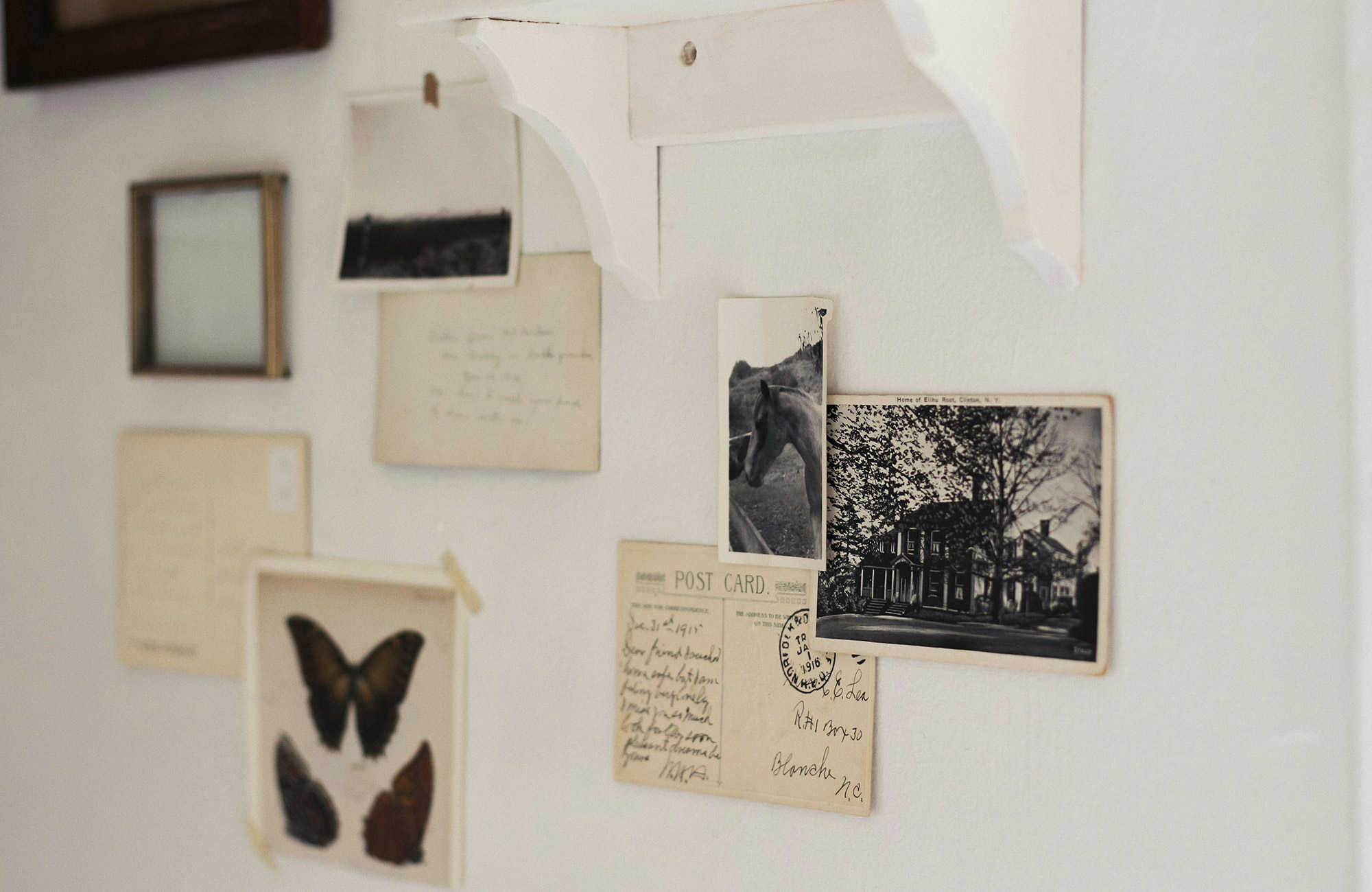 Wall of old images and sentimental notes and postcards