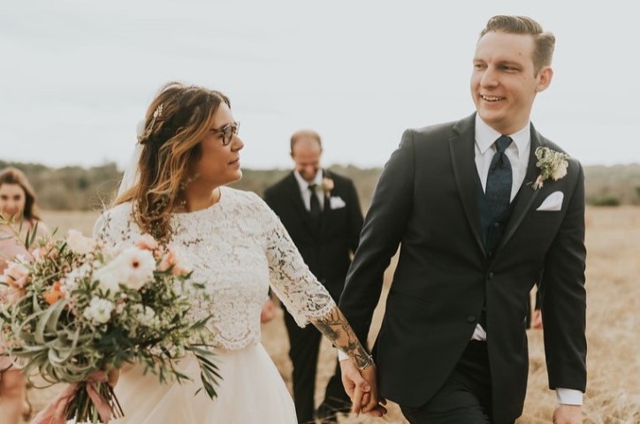Bride and groom holding hands