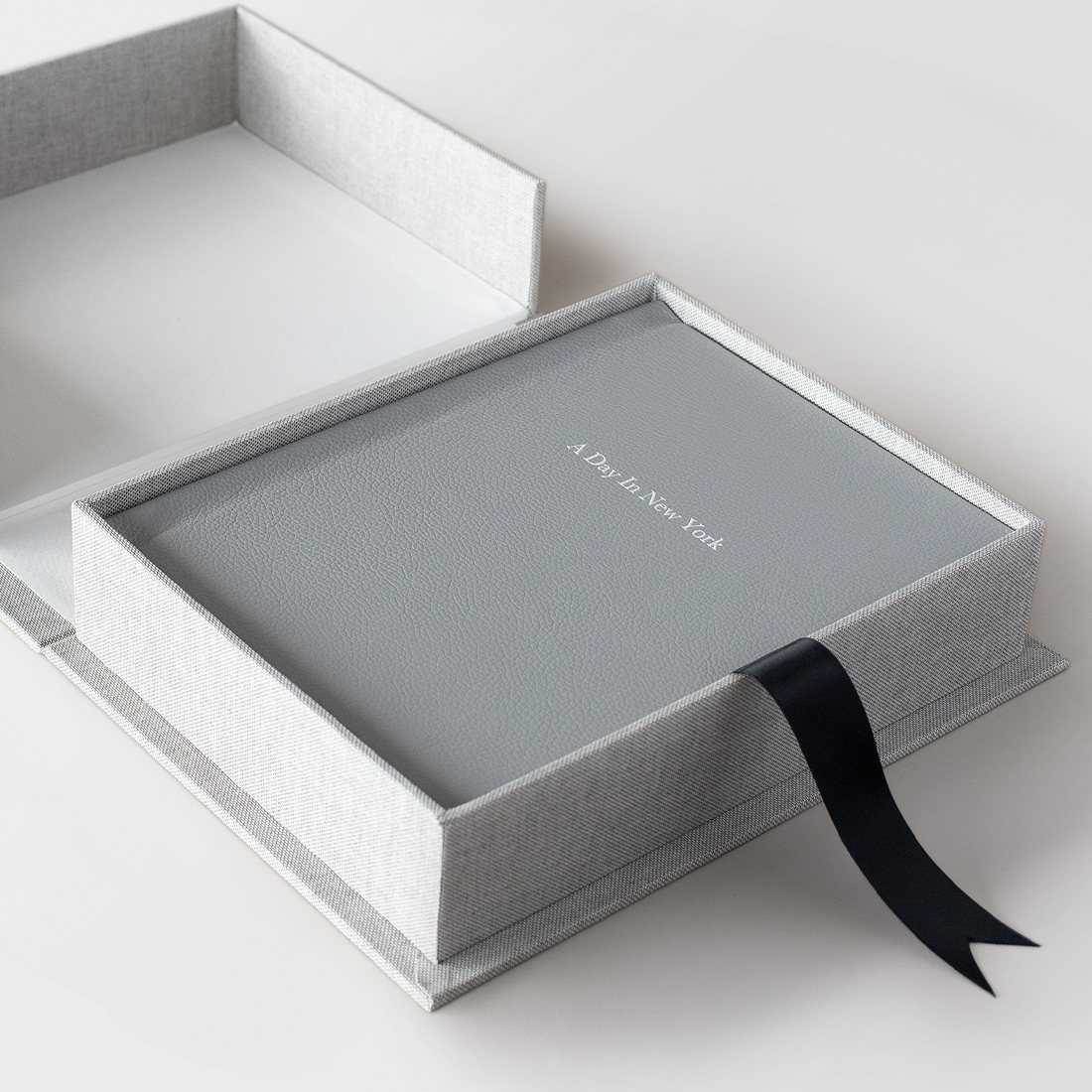 Grey Premium Leather Photo Album in grey linen Presentation box with black ribbon