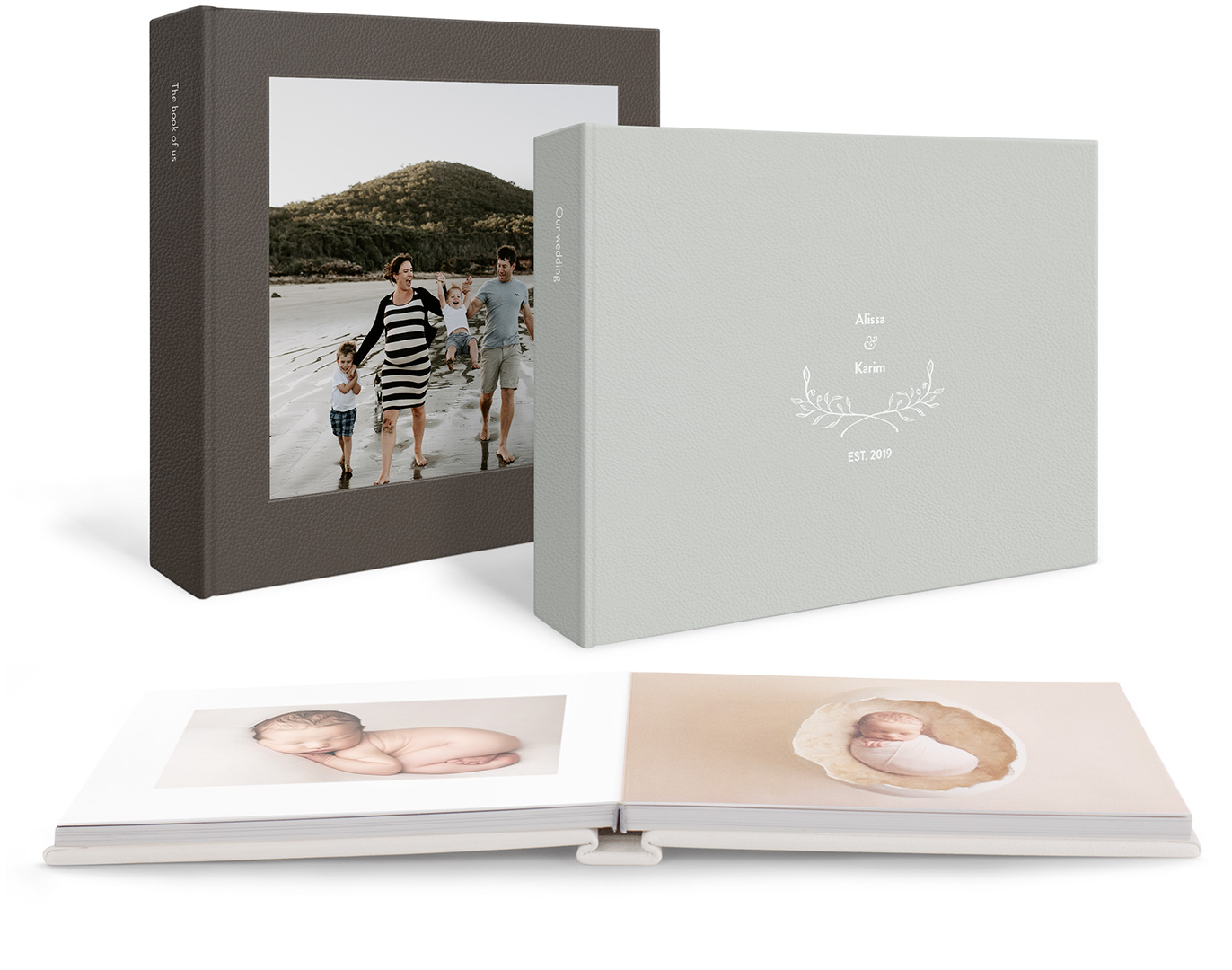 Three leather photo albums with family, wedding and baby imagery.