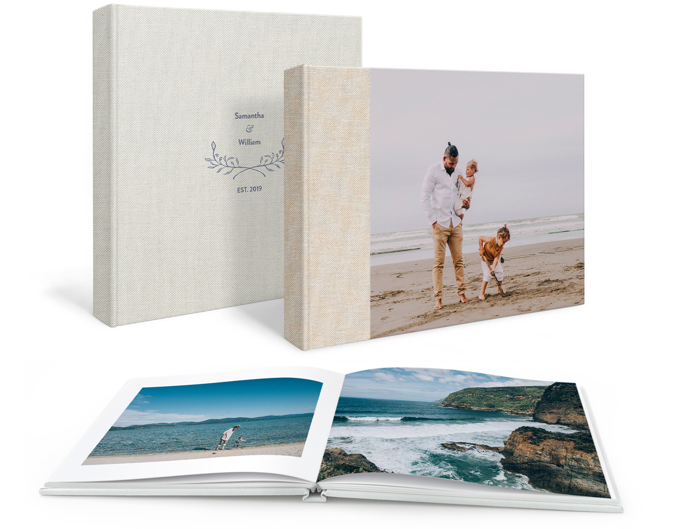 Two standing premium photo books; text only on one cover, and a father with his two children at the beach on another. And an open photo book in the foreground with images of the sea.