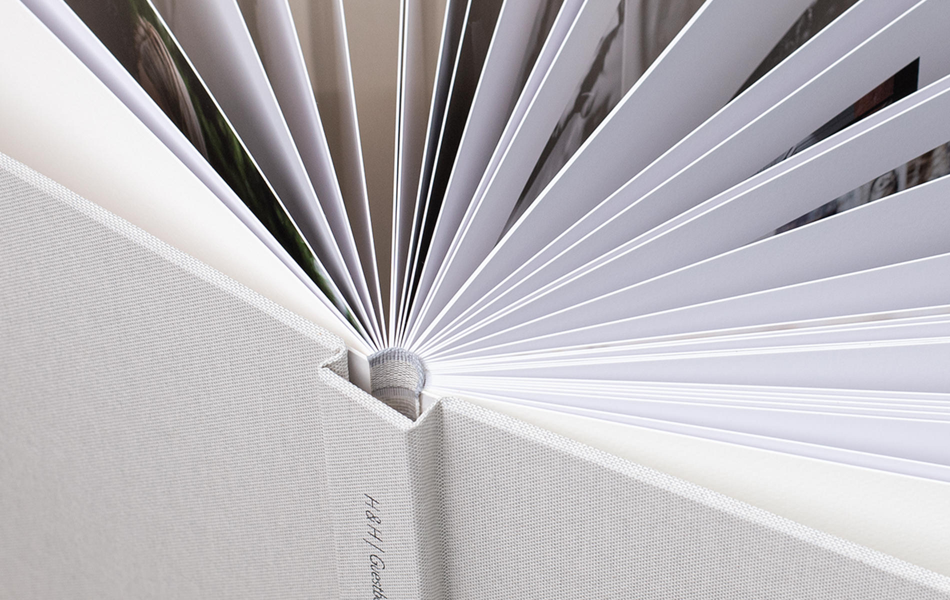 Open Premium Photo Book with close up of pages spread out to see thickness and quality