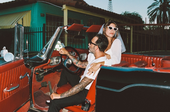 Couple in a retro car after their wedding day