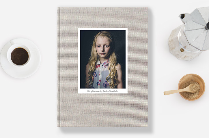 Premium Photo Book with photo of young girl on cover