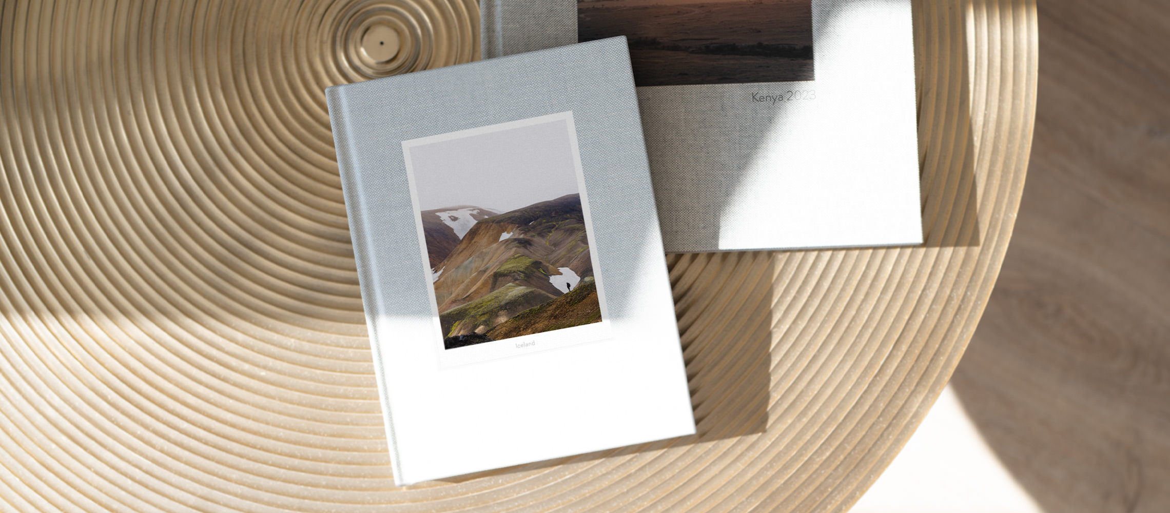 Pale blue portrait photo book titled Iceland