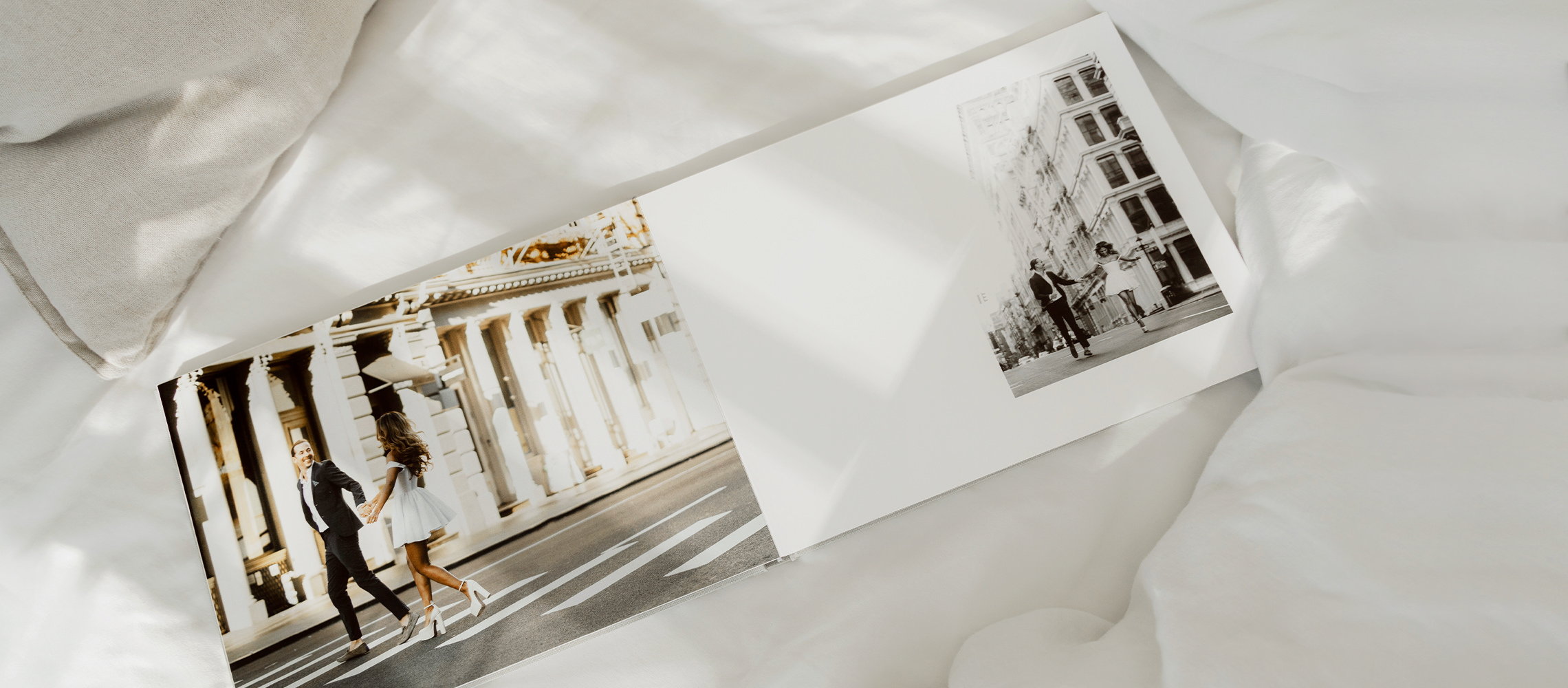 Photo of newlyweds crossing the road together in landscape photo album