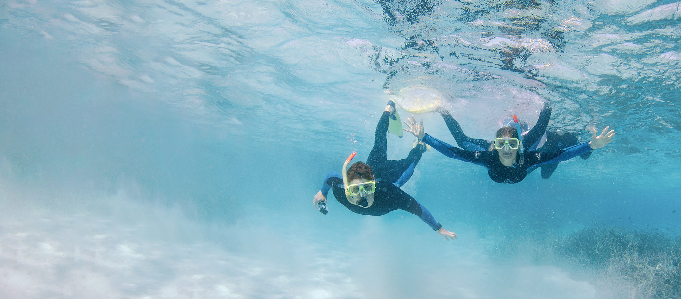 Underwater photo of couple snorkelling