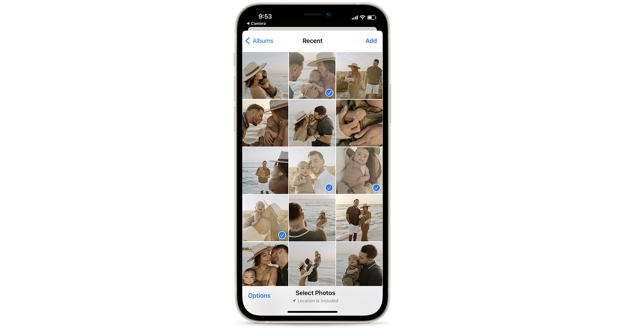 Mobile phone with camera roll on screen with several photos selected