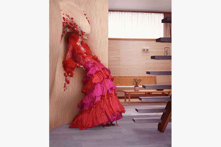 Flamenco woman stands against beige wall with head merged inside the wood in sunlit home