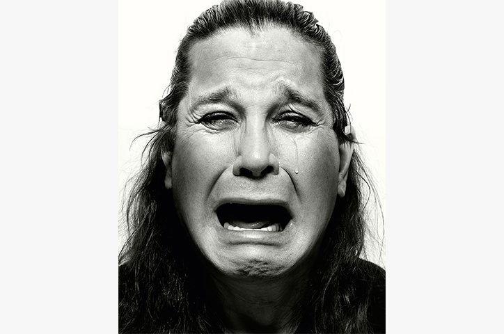 Ozzy Osbourne crying facing camera