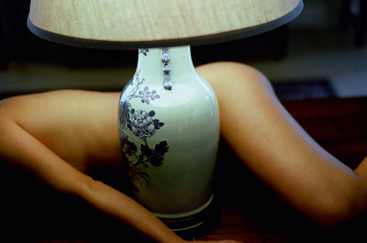 Woman lying by lamp - Untitled, 2007.